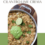 One-pan arroz con pollo topped with vibrant avocado cilantro lime crema, garnished with fresh cilantro and lime. A flavorful, dairy-free and gluten-free chicken and rice dinner perfect for meal prep or casual hosting