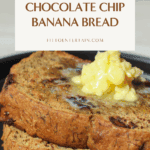 Two thick slices of chocolate chip banana bread topped with melty butter on a matte black plate. The loaf is golden brown, studded with chocolate chips, and perfectly soft and moist.