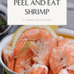 A bowl of peel & eat shrimp seasoned with Old Bay and served with lemon wedges. The shrimp are plump, pink, and perfectly cooked.