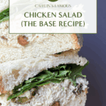 Close-up of a stacked chicken salad sandwich on thick bread with leafy greens, showing a creamy chicken filling mixed with pistachios.