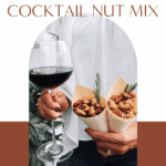 Two cones of rosemary cocktail nut mix held next to a glass of wine—perfect for easy entertaining.