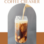 Pouring creamy salted caramel coffee creamer into a glass cup of shaken espresso.