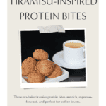 Tiramisu protein bites stacked on a white ceramic dish, lightly dusted with cocoa powder, showing a soft, espresso-speckled texture against a dark background.