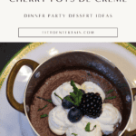 Silky dark chocolate pots de crème topped with whipped cream, fresh berries, and mint in a small copper pan for an elegant dinner party dessert.