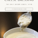 Creamy homemade blue cheese dressing in a white bowl with spoon
