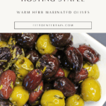 Warm herbed marinated olives baked with lemon zest and olive oil, served as an easy appetizer for entertaining.