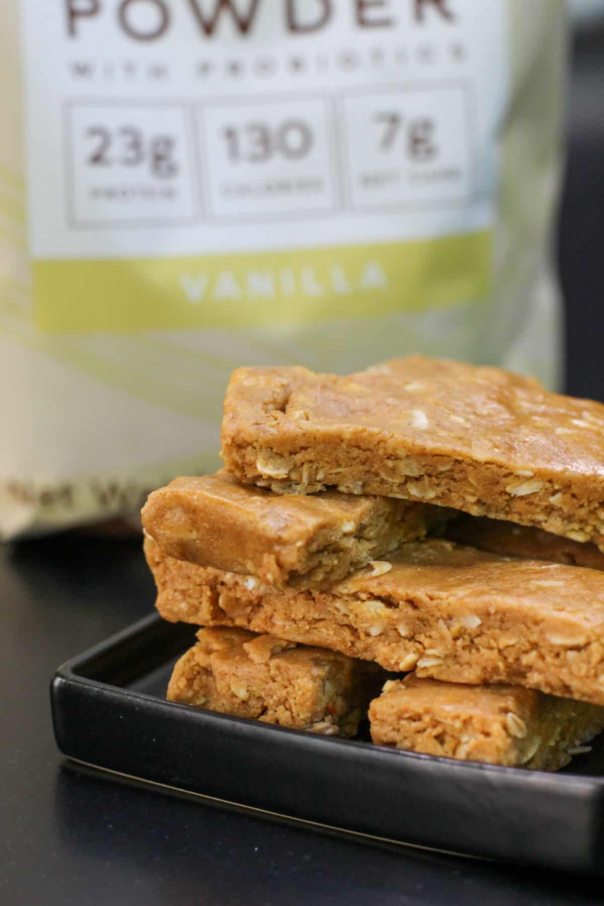 Close-up of homemade peanut butter protein bars made with oats, peanut butter, honey, and vanilla protein powder, highlighting their chewy texture.